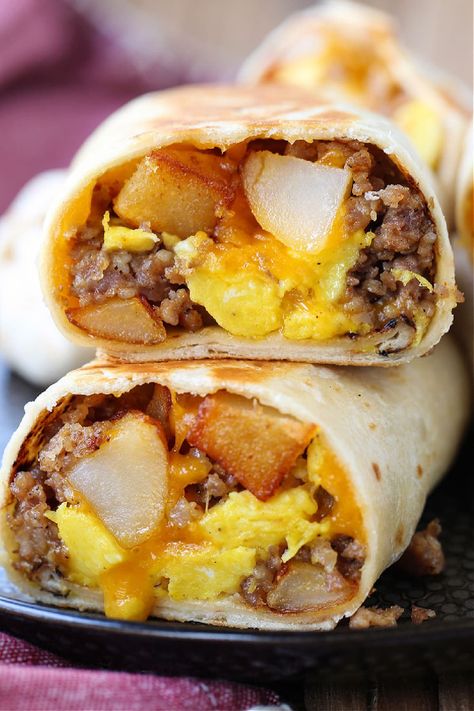 Freezer Breakfast Burritos make mornings on the go easy! Heat in the microwave from frozen and in minutes you have a hearty, delicious meal! Breakfast Burritos For A Crowd, Breakfast Sandwich Meal Prep, Freezer Burritos, Potatoes And Eggs, Make Ahead Breakfast Burritos, Easy Breakfast Burritos, Frozen Burritos, Microwave Breakfast, Portable Breakfast