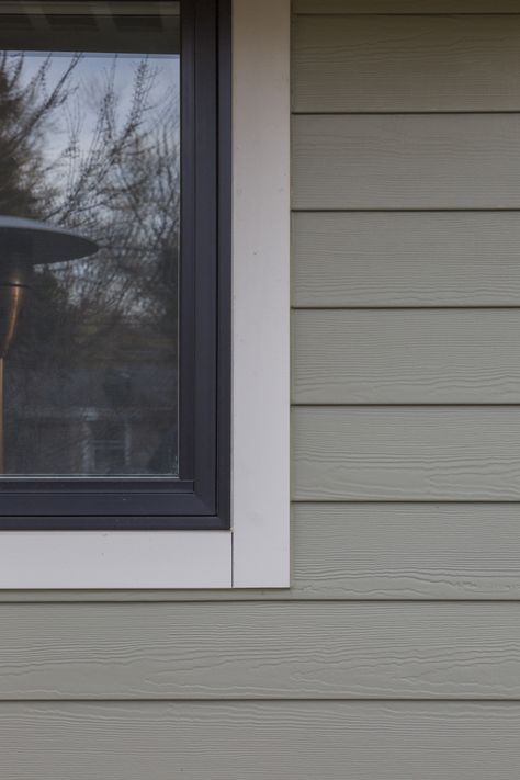 Andersen A-Series Black Window with CobbleStone trim and Heathered Moss James Hardie Siding Siding Colors With Black Windows, Grey Siding With Black Windows, Exterior Paint Colors With Black Windows, Cedar Shake Siding Black Windows, Black Windows Exterior Color Schemes, Black Exterior Windows, Heathered Moss Hardie Siding, James Hardie Siding Ideas Night Gray, Moonlit Moss Vinyl Siding