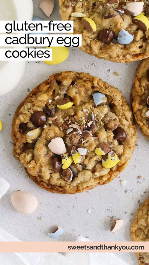 This Gluten-Free Cadbury Egg Cookies recipe is made with a chewy oatmeal cookie base, plenty of chocolate chips & Cadbury mini eggs in every bite! (So, basically, the perfect Easter cookie recipe!) If you need an easy gluten-free Easter dessert to try this year, these cookies are the PERFECT option. Gluten Free Easter Cookies, Cadberry Eggs Cookies, Gluten Free Cadbury Egg Cookies, Cadbury Eggs Cookies, Cadbury Egg Cookies, Cadbury Cookies, Cadbury Creme Egg Cookies, Chewy Oatmeal Cookie, Easter Cadbury Egg Cookies