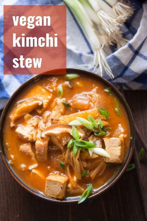 Warm up, with this spicy kimchi stew that's made with with tender shiitake mushrooms and crispy pan-fried tofu! Easy, vegan, and packed with spicy flavor, this cozy meatless stew is hearty enough to make a meal of and perfect on cold winter days. #veganrecipes #koreanfood #kimchi #tofu #stew #meatlessmonday Meatless Stew, Vegan Stew Recipes, Tofu Stew, Kimchi Stew, Spicy Kimchi, Healthy Vegan Dinner Recipes, Vegan Kimchi, Healthy Vegan Dinner, Vegan Dinner Recipes Easy