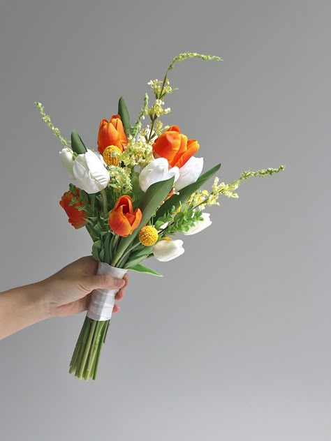 White Yellow Orange Bouquet, Nosegay Bridal Bouquet, Bridal Bouquet Tulips And Roses, Prom Bouquet Ideas Orange, Small Orange Bouquet, Simple Colorful Wedding Bouquet, Summer Wedding Flowers Bouquets Simple, Orange And White Flower Bouquet, Artificial Hand Bouquet