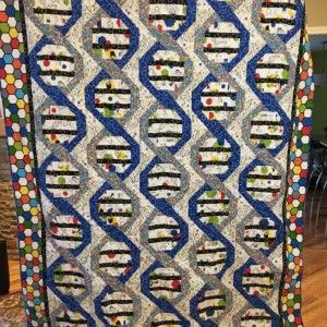 My son just completed his PhD in molecular biology. So I looked for a DNA quilt pattern and found this free pattern from In the Beginning Fabrics. All the fabrics and pattern are from their website. The quilt is 98 Science Quilt Patterns, Dna Beaded Bracelet, Dna Quilt Pattern, Science Themed Quilts, Nerdy Quilt Patterns, Haptic Lab Constellation Quilt, Dna Beads, Dna Helix, Military Quilts