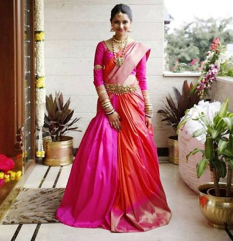 Gorgeous pink & orange lehenga saree for the wedding. See more on wedmegood.com #wedmegood #indianwedding #indianbride #lehenga #lehengacholi #bridallehenga #bridallehengacholi #lehengasaree #saree #southindianwedding #southindianbride #pink Cancan Saree Drape Bride, Cancan Saree, Indian Engagement Outfit, South Indian Bride Saree, Sari Lehenga, Lehenga Saree Design, Saree Wearing Styles, Half Saree Lehenga, Saree Draping Styles