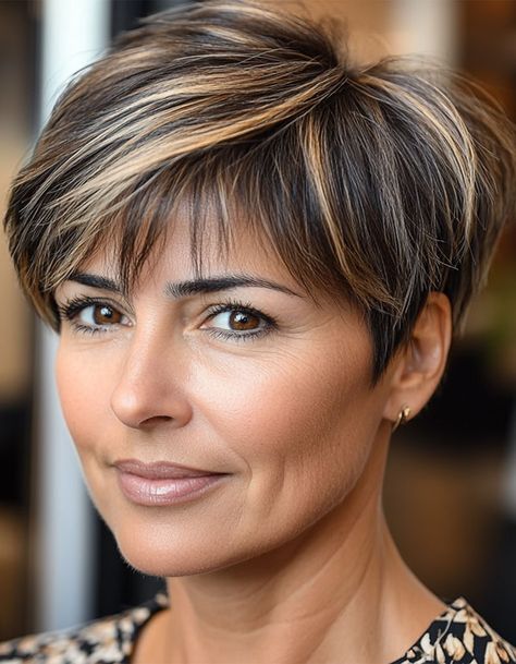 17. Chic Brunette Pixie with Highlights This chic brunette pixie haircut is effortlessly stylish, with subtle highlights that add texture and dimension to the darker base. The short, neat layers keep this look fresh and modern while being super low-maintenance. Light Brown Pixie Haircut, Brunette Pixie Haircut, Brunette Pixie With Highlights, Pixie With Highlights, Haircut For Women Over 50, Pixie Haircut For Women, Pixie Hair Color, Pixie Cut With Highlights, Brown Pixie Cut