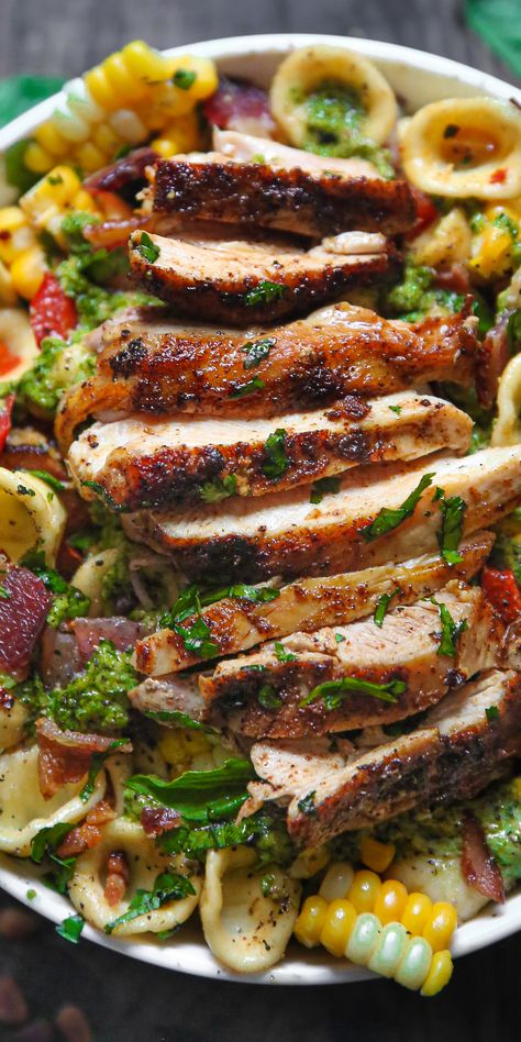 Chicken and Corn Pasta Salad with Bacon, Bell Peppers, and Creamy Pesto Dressing - in a white bowl. Sunday Lunch Ideas Families, Creamy Pesto Dressing, Pasta Salad With Bacon, Fresh Corn On The Cob, Pasta Bacon, Bacon Pasta Salad, Cold Pasta Dishes, Grilled Chicken Pasta, Summer Pasta Dishes