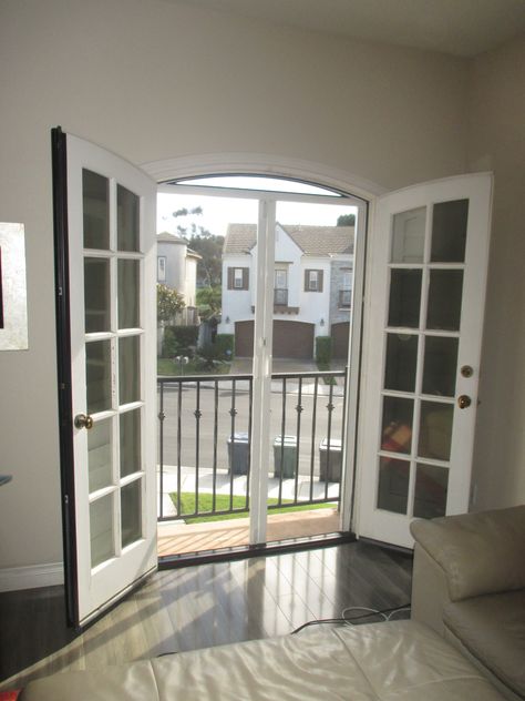 Have you been told that you can't put a Screen on an Arched Door? Have you been told that you can't put a Retractable Screen on an Arched Door?  Stop listening to what others tell you because Classic Home Improvement Products of Anaheim Hills can custom build you a fixed top arch screen to cover the arch and a Retractable Screen to cover the door opening. Take a look at the pictures attached of a recent French Arched Door Retractable Inswing Screen Door in San Juan Capistrano, California. Tv Room Living Room, Painted Screen Doors, Pergola Over Deck, Pergola Garage Door, French Doors With Screens, Arch Windows, Pergola Decorations, Screen Printing Supplies, Retractable Screens