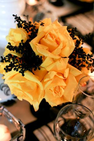 Simple but really effective Halloween inspired wedding flowers - yellow rose Black Red And Yellow Wedding, Black And Yellow Wedding Theme, Dark Purple And Yellow Wedding, Black And Yellow Wedding, Red Yellow Black Wedding Theme, Black And Yellow Bouquet, Yellow And Black Wedding Decor, Yellow Black And White Flower Arrangements, Batman Wedding Theme