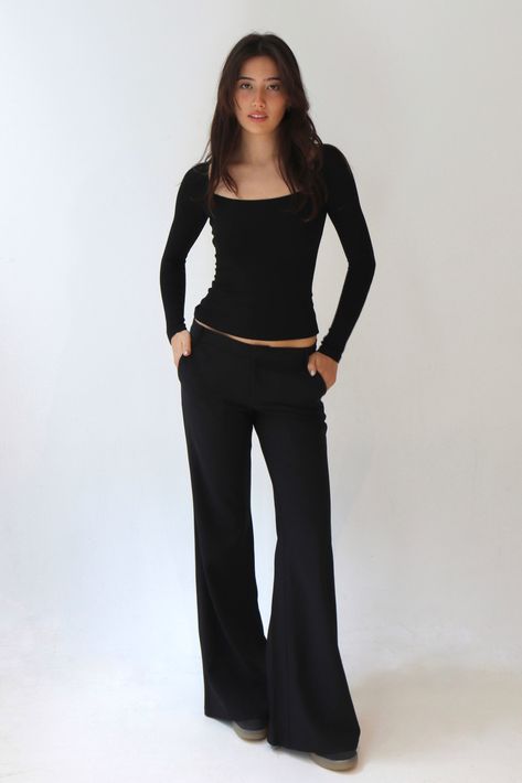 Drawing inspiration from the iconic attire of "Charlie's Angels," the Lucy low-rise trousers are a stylish nod to the film. Features Designed to accentuate your curves and showcase the natural contours of your body. Crafted from a smooth fabric, they gracefully embrace your figure, highlighting your shape. The low/mid-waisted design with a straight or wide-leg fit and breathable material, these trousers prioritize your comfort, ensuring you can move with ease while maintaining a fashionable look Black Low Waisted Pants, Black Pants Low Waist, Body Flattering Outfits, Low Waist Tailored Pants, Comfortable And Stylish Outfits, Low Rise Black Pants Outfit, All Black Semi Formal Women, Low Rise Dress Pants, Wide Waist Body Shape Outfits