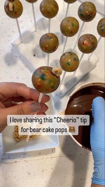 Janet on Instagram: "Stress no more! Add a couple cheerios on that round cake pop and 💥 bam a cute little teddy 🐻 #teddybearcakepops #teddycakepops #bearcakepops #reels #reelsinstagram #reelsofinstagram #fyp" Teddy Bear Theme Cake Pops, Teddy Bear Cake Pops How To Make, We Can Bearly Wait Sweets Table, Bearly Wait Cake Pops, Bear Cake Pops Tutorial, Bear Theme Cake Pops, Birthday Cake Pops Ideas, We Can Bearly Wait Baby Shower Treats, Bear Baby Shower Desserts