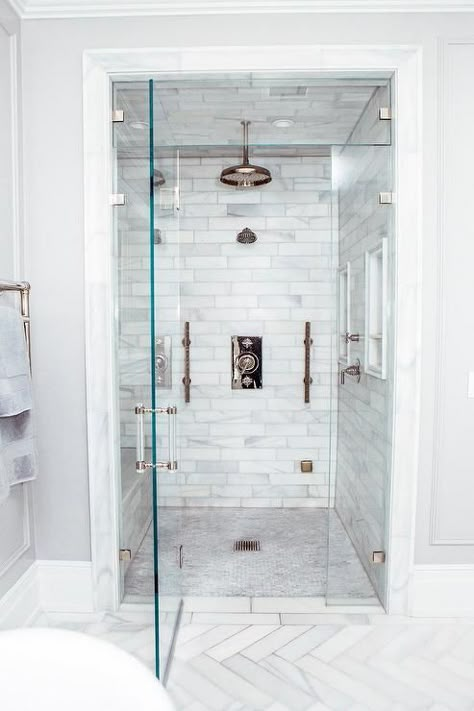 Walk-in steam shower with staggered honed marble tiles, multiple side by side shower heads and a mosaic marble floor. Steam Room Shower, Bathroom Shower Panels, Bad Inspiration, Steam Shower, Steam Showers Bathroom, Transitional Bathroom, Master Bath Remodel, Bathroom Remodel Shower, Steam Showers