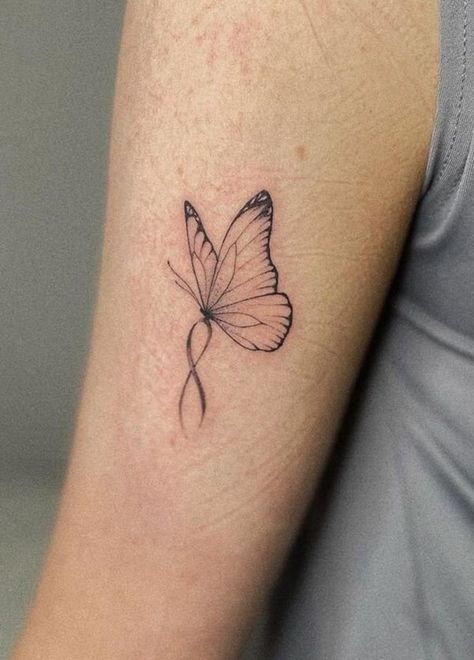 100 Unique Butterfly Tattoo Ideas (Best Butterfly Tattoos) - The Trend Scout Butterfly Awareness Ribbon Tattoo, Butterfly Tattoo With Ribbon, Butterfly With Pink Ribbon Tattoo, Ribbon And Butterfly Tattoo, Purple Ribbon Butterfly Tattoo, Butterfly With Ribbon Tattoo, Cancerian Butterfly Tattoo, Word Butterfly Tattoo, Miscarried Butterfly Tattoo