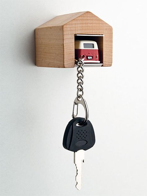 A good example of simple gamification. The garage is a natural home for the car on your key holder, it is a reminiscence of your childhood games, which makes you want to park your car even more. Wooden Key Holder, Wooden Garage, Car Key Holder, Garage House, Holder Design, Vw Bus, Ikea Hack, Car Keys, Key Holder