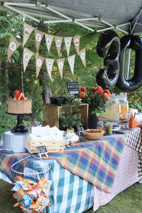 Camping 30th Birthday Ideas, Camping Birthday Ideas Adults, 30th Camping Birthday, Diy Food Signs For Party Buffet, 30th Birthday Camping Trip, Camp Party Table Decor, Camp Themed 30th Birthday, Outdoors Themed Birthday Party, 30th Birthday Camping Party