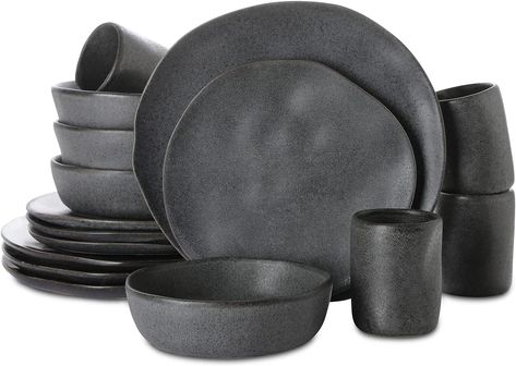 Stone by Mercer Project HEKONDA Debossed Stoneware 16-Piece Dinnerware Set, Gray SERVICE FOR 4 - Beautify your table setting with this organic round shape and textured dinnerware set. The stoneware set service for 4 includes salad plates (8.8-inch), dinner plates (11-inch), bowls (20 fl.oz) and cups (10 fl.oz). UNIQUE ARTISTIC PIECE - The organic shapes, tactile cues, and hand carved inspirational notes are all evidence of human touch, and illustrate the artistic process. Ceramic Dinnerware Set Rustic, 80s Apartment, Black Tableware, Grey Dinnerware, Plates And Bowls Set, Modern Dinnerware, Beige Ceramic, Stoneware Dinnerware Sets, Stoneware Dishes