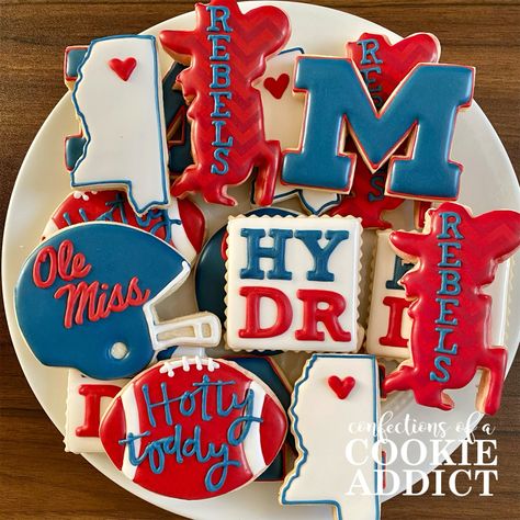 Ole Miss Sugar Cookies Ole Miss Grooms Table, Ole Miss Tailgate Decorations, Ole Miss Birthday Party Ideas, Ole Miss Birthday Cake, Ole Miss Bound Graduation Party, Ole Miss Cake Ideas, Ole Miss Cookies Decorated, Ole Miss Bed Party, Ole Miss Nails