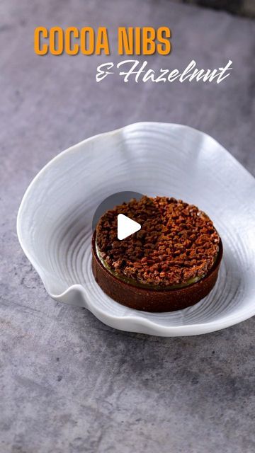 Andrea Petreri on Instagram: "Looking for ideas on how to use the cocoa nibs tuile that I shared in the previous post? Here is one that I personally love 😍 This is a beautiful tartelette with some caramel on the bottom, hazelnut praline ganache in the middle and the cocoa nibs tuile on top. Minimalistic design but still very tempting and, above all, delicious (trust me 😄) #tartelette #tart #cake #tartlet #hazelnuts #hazelnut #tuile #tuille #cocoanibs #chocolate #chocolatelover #chocolatelover🍫 #caramel #recipe #pastryrecipe #platingidea #platingideas #homecooking #homepastry #pastryart #pastryartist" Chocolate Tart Decoration, Tart Cake, Caramel Recipe, Fine Dining Desserts, Hazelnut Praline, Cocoa Nibs, Pastry Art, Chocolate Tart, Pastry Recipes