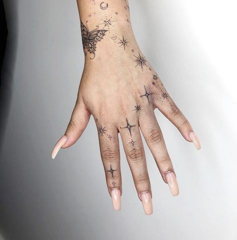 Hand Tattoos With Stars, Sparkle Hand Tattoo Ideas, Sparkles Finger Tattoo, Sparkle Tattoos On Hand, Sparkly Hand Tattoo, Starry Hand Tattoo, Sparkles On Hand Tattoo, Mystical Hand Tattoo, Sparkles Hand Tattoo