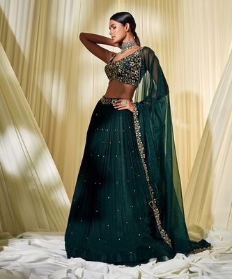 Bottle Green Lehenga Set - DISHA MUCHHALA - 4008113 Bottle Green Indian Outfit, Indian Designer Blouses, Indian Bachelorette Party Outfit, Dark Green Lehenga Designs, Trending Lehenga Designs 2023, Bottle Green Suits Women Indian, Lehenga Designs Green, Lehengas For Bridesmaid, Dark Lehenga