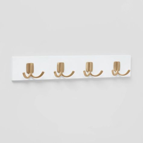 Create additional storage in your home with this Modern Octopus 4-Hook Rail with Gold Hooks from Brightroom™. This decorative hook rail with a clean modern design showcases a flat white base that has four gold-finish dual hook points for hanging hats, coats, jackets, belts or other items. Just wall mount it in your laundry room, bathroom, entryway or kitchen to maximize storage space. Brightroom™: See your space in a new light. Light Pink And Gold Room Ideas, Cute Hooks For Wall, Gold Hooks Entryway, Gold Wall Hooks, Bedroom Hooks On Wall, White And Gold Room Decor, Dorm Room Bathroom Ideas, Collage Furniture, Preppy Bathroom