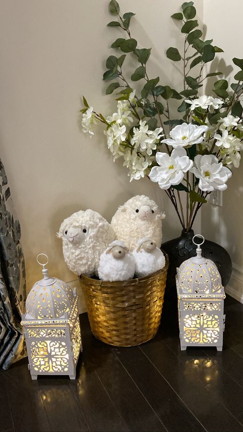 Instead of decorating this corner of my house with the fawanees I like to reserve for Ramadan, I came up with this simple but meaningful set-up for Bakrid. The sheep and florals are from Dollarama, and the white fawanees are from another dollar store, but you should be able to find them anywhere (as they seem to be pretty common in Muslim holiday decor on Pinterest). Bakrid Aesthetic, Sheep Room Decor, Eid Home Decor, Eid Adha Mubarak Decoration, Eid Ul Adha Decorations Ideas, Eid Al Adha Decorations, Ramadhan Decor, Ramadan Home Decor, Eid Saeed