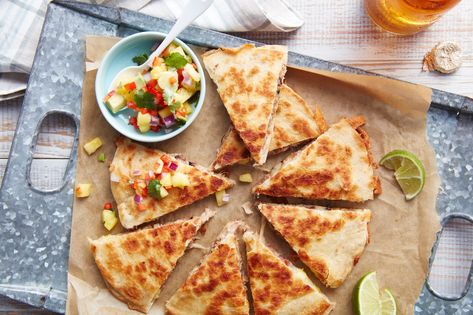 Each quesadilla is packed with a combination of pineapple, cilantro, red onion, shredded smoked pork, and shredded Monterey Jack cheese. Easy Main Dishes, Football Party Food, Going Vegetarian, Smashed Avocado, Quesadilla Recipes, Quesadillas, Mexican Dishes, Southern Living, Yummy Appetizers