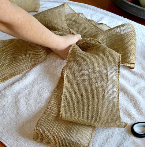 How to make a DIY big burlap ribbon in minutes with a few supplies. The perfect farmhouse touch for a front door wreath. Burlap Bow Tutorial, Burlap Ribbon Bow, Diy Tree Topper, Easiest Burlap, Burlap Wreath Tutorial, Burlap Wreath Diy, Burlap Garland, Pew Bows, Quick And Easy Crafts