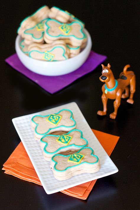 Scooby Snack Cookies Appeal to the Kid in Us | Instead of using the typical sugar cookie recipe, these bone shaped cookies are made from a sweet and salty peanut butter cookie dough.  They are sandwiched together with a peanut butter buttercream.   #kidfriendly Blue Falcon, Snack Cookies, Kid Friendly Dessert, Scooby Snacks, Peanut Butter Cookie Dough, Shaped Cookies, Buttercream Filling, Dog Bakery, Fun Recipes