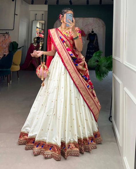 Who says you can't be trendy and traditional at the same time? 🤷🏻‍♀️ This Jacquard Silk Paithani Lehenga Choli is the perfect classic and contemporary fashion🧡🤍 *Catalogue : RUDRANI* *LNB2005ONG* *LNB2005WHT* *Lehenga(Stitched)* Lehenga Fabric : Jacquard Silk (Paithani) Lehenga work : Weaving Zari Work Lehenga Waist : SUPPORTED UP TO 42 Lehenga Closer : Drawstring with Handmade Tassels Stitching : Stitched With Canvas and Can Can Length : 41 Flair : 4 Meter Inner : Micro Cotton *Blous... Indian Style Dress, Paithani Lehenga, Silk Half Saree, Saree Function, South Indian Style, Half Saree Lehenga, Bollywood Lehenga, Half Saree Designs, Indian Lehenga