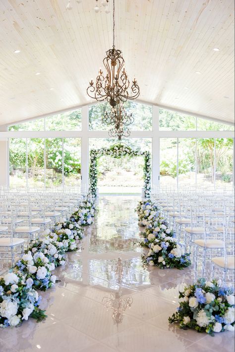 Blue White and purple florals lining the aisle at the (Tate House Wedding) Venue in Jasper Georgia white marble floors natural light wedding inspiration decor Blue Themed Wedding Decoration, Wedding Venues Blue And White, Blue And White Wedding Venue Ideas, Wedding Venue Blue Theme, Dusty Blue And Navy Wedding Theme Wedding Ceremony Decor, Wedding Color Light Blue, Blue Ceremony Decor, Floral Wedding Stage Decor, Cheap But Classy Wedding Ideas