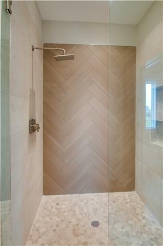 Shower Chevron Tile, Herringbone Wood Tile Bathroom, Wood Bathroom Tile Wall, Wood Slat Look Tile, Wood Look Tile Herringbone Pattern, Master Shower Wood Tile, Marble And Wood Look Tile Bathroom, Wood Tiled Bathrooms, Chevron Tile Bathroom Shower Walls