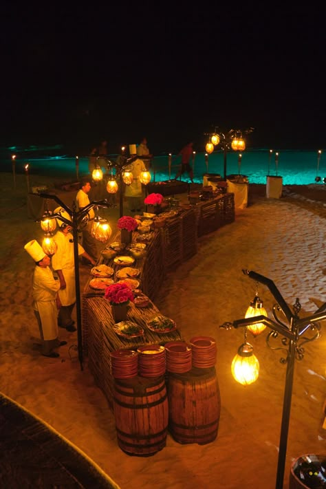 rustic buffets and lanterns Bbq On The Beach, Luau Aesthetic, Beach Buffet, Night Beach Weddings, Eclectic Dishes, Wedding Food Display, Buffet Wedding Reception, Outdoor Buffet, Wedding Buffet Food