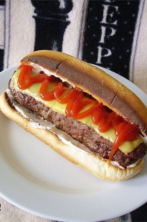 All-American Burger Dog | "Great recipe for a classic burger that just happens to be shaped like a hot dog!" #grilling #grillingrecipes #grillingideas Cheeseburger Hot Dogs, Burger Dogs Recipes, Hot Dog Burger, Bacon Burger Dog, Hot Dog Quesadilla, Leftover Hot Dog Buns, Toasted Hot Dog Buns, Burger Dog, Burger Hot Dog