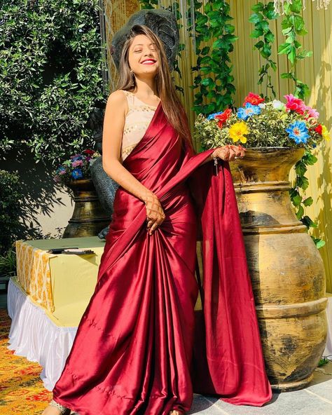 Satin Saree Red Colour, Red Colour Saree For Farewell, Saree Poses In Garden, Sarii Poses, Wine Saree Look, Red Saree Contrast Blouse, Satin Saree Party Wear, Red Satin Saree, Graduation Saree