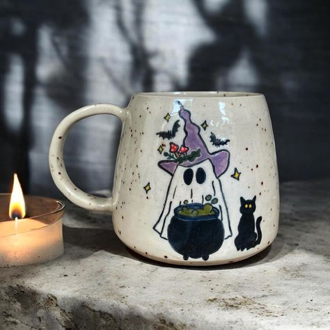 Boo! 🦇🕸️ It’s always halloween season for me ✨🍂 #londonpotters #ceramics #ceramicart #autumn #autumnvibes #stoneware #wheelthrown #coffee #coffeetime #coffeelover #coffeeshop #mug #coffeemug #tableware #pottery #ceramicstudio #ceramiclove #handmadeceramics #beginnerpotter #halloween #londonartist #handmadepottery #mugs #functionalceramics #handthrown #handcrafted #handmademug #pottersofinstagram #wheelthrowing Autumn Mug Painting Ideas, Halloween Mugs Diy, Autumn Mug Painting, Pottery Mugs Painting Ideas, Ceramic Painting Halloween, Halloween Ceramic Painting, Pottery Painting Halloween, Funny Pottery Painting Ideas, Fall Pottery Painting Ideas