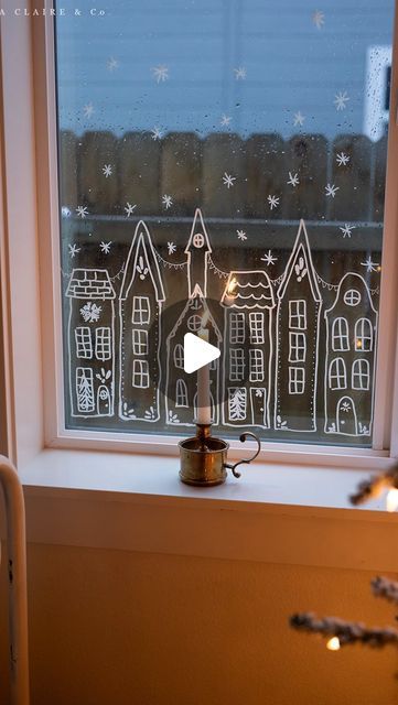 Kristen Whitby on Instagram: "(Comment “village” and I’ll send it to you)✨A European inspired Christmas village stencil- my sweet girl squealed when she saw it come to life in her window. 

We plan to repeat it in her other windows to compliment her vintage inspired tree- which I’ll share soon. 

We moved the other paper village (also a printable) to another room and had so much fun drawing this one in here. It looks magical as it reflects the twinkle lights glowing from inside and outside her window. ✨

I love the sweet details and warm ambiance of this time of year. She’s planning on keeping it up all winter long and that makes me so happy.✨" Candles In Windows For Christmas, Christmas Window Template, Christmas Village Printable, Christmas Village Window Drawing, Christmas Village Stencil, Holiday Candle In Window, Christmas Village Window Stencil, Christmas Window, Twinkle Lights