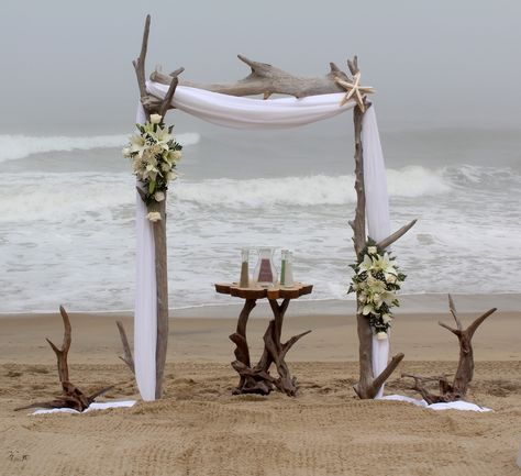 Standard Driftwood Arch with added driftwood accents and florals! Ocean Ceremony, Driftwood Wedding Arch, Driftwood Wedding Arches, Driftwood Arch, Wood Wedding Arches, Driftwood Wedding, Beach Wedding Guest Book, Beach Wedding Groomsmen, Beach Wedding Arch