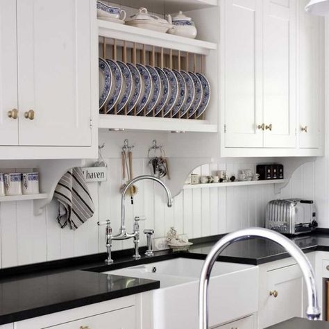 Pretty kitchen with beadboard backsplash, built-in plate rack, and small, under-cabinet wall shelves. White Beadboard Kitchen, Black Quartz Kitchen Countertops, Beadboard Kitchen Backsplash, Kitchen Beadboard, Beadboard Kitchen, White Beadboard, Diy Kitchen Backsplash, Unique Backsplash, Beadboard Backsplash