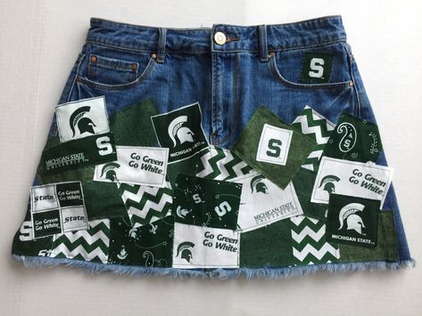 MSU Michigan State University Spartans Ladies denim patch skirt BritchesNBows.etsy.com Diy College Apparel, Msu Outfit, College Attire, Tailgate Clothes, Jean Jacket Diy, Reworked Clothes, School Skirt, Football Game Outfit, Diy Jacket