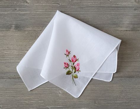 Vintage Embroidered Handkerchief ~ Four pink long-stemmed roses are featured on this white handkerchief. The flowers are machine embroidered with silky floss. It is made of soft, white cotton and finished with a straight machine hem. Tag was removed to launder. A nice, simple old fashion hankie for gift giving or for your collection.  Measures 11.5 x 11.5 inches Thanks for visiting → RoseAnaDana.Etsy.com 10% OFF 2 or More Items Use Code SAVE10 Hand Embroidery Handkerchief, Handkerchief Drawing, Embroidery On Handkerchief, Vintage Handkerchief, Hanky Embroidery Design, Handkerchief Embroidery Design, Handkerchief Embroidery, Embroidered Hankies, Baby Dress Diy