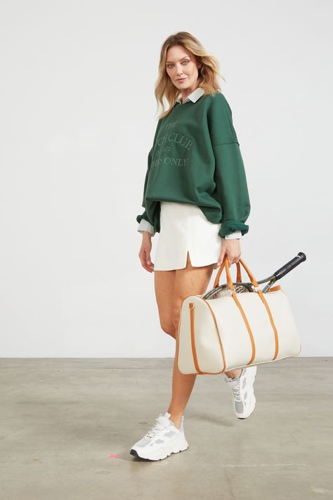 A green oversized sweatshirt paired with a mint striped button up and a sleek white tennis skirt for that preppy-athletic outfit. Golf Outfits Women White Skirt, Green Tennis Outfit, Preppy Tennis Outfit, Preppy Sporty Outfits, Green Tennis Skirt Outfit, Unpolished Casual, Sportwear Outfit Woman, Olympic Outfits, Green Tennis Skirt