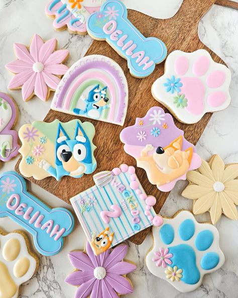 Bluey cookies for a precious girl turning 2! Summer slots are filling fast. Have you placed your orders yet? #blueyparty #birthdaydecoratedcookies #nwadecoratedcookies #royalicingcookies Bluey Sugar Cookies Girl, Fun Decorated Cookies, Bluey Sugar Cookie, Bluey Cookies For Girl, Bluey 3rd Birthday Party For Girl, Bluey Cookies Decorated, Bluey Cookies, 3rd Birthday Party For Girls, Kids Birthday Party Cake