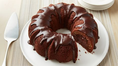 This recipe, arguably the recipe most closely identified with the Bake-Off® Contest, mysteriously develops a "tunnel of fudge" filling as it bakes. Don't scrimp on the nuts, or it won't work! Fudge Bundt Cake Recipe, Tunnel Of Fudge Bundt Cake Recipe, Tunnel Of Fudge Bundt Cake, Fudge Bundt Cake, Tunnel Cake, Tunnel Of Fudge Cake, Fudge Cake Recipe, Tube Cake Pan, Bake Off Recipes