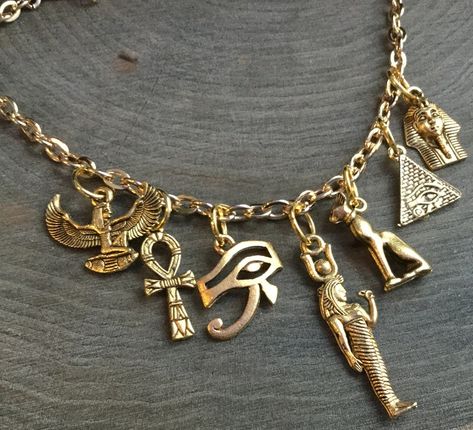 Egyptian Eye of Horus, Winged Goddess Pyramid, Bastet, gold charm necklace Egyptian Jewelry Necklaces, Egyptian Accessories Jewellery, Gold Egyptian Jewelry, Egiption Style, Egyptian Style Jewelry, Eye Of Horus Jewelry, Gold Aesthetic Jewelry, Egyptian Jewelry Ancient, Pyramid Jewelry