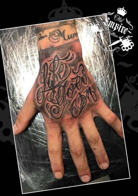 Did this #Lettering #Tattoo covering the hand. The client sat very well! #LifeGoesOn #Script #Quotation #BlackandGrey #CleanLines #HandTattoo #Coils4Life #OldEmpireTattoo #OET #LittleHulton #Walkden Lettering On Hand Tattoo, Life Goes On Hand Tattoo, Hand Tattoos For Guys Writing, Hand Tattoo Text Men, Hand Script Tattoo, Tattoo Handwriting Fonts, Tattoo Covering, Crossed Arrow Tattoos, Tuff Pics