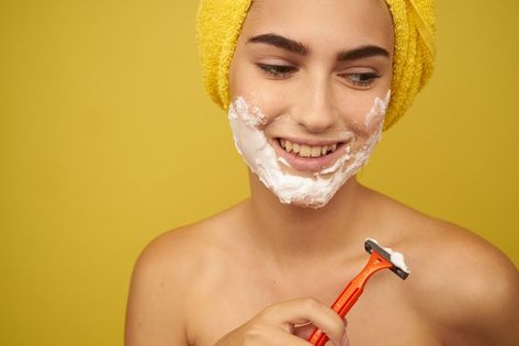 Woman shaving her face with a razor | Premium Photo #Freepik #photo #beauty #face #female #young Shaving Your Face Women, Woman Shaving Man, Face Razor For Women Tutorial, Face Shaving Female, Facial Razor Women, Woman Shaving, Bright Makeup, Face Pictures, Fresh Skin