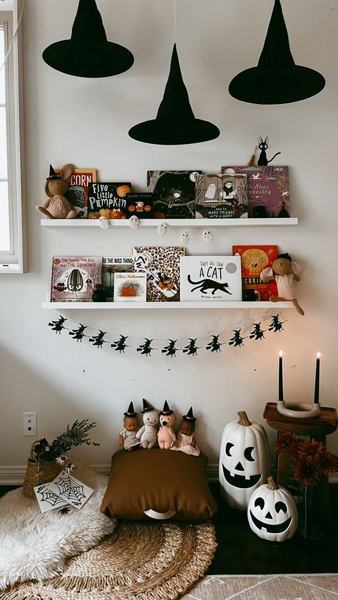 Halloween Playroom Ideas, Cute Witch Halloween Decor, Kids Bookshelf Decor, Halloween Decor Playroom, Halloween Decorations Bookshelf, Halloween Decorations Colorful, Floating Shelves Halloween Decor, Nursery Halloween Decor, Witch Nursery Ideas