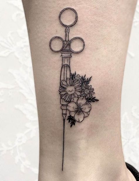 38 Beautiful Nurse Tattoos with Meaning - Our Mindful Life Dainty Medical Tattoo, Anesthesiologist Tattoo Ideas, Medicine Inspired Tattoos, Cute Medical Tattoos, Hospital Tattoo Ideas, Emergency Nurse Tattoo, Nurse Lamp Tattoo, Nurse Practitioner Tattoo Ideas, Mortician Tattoo