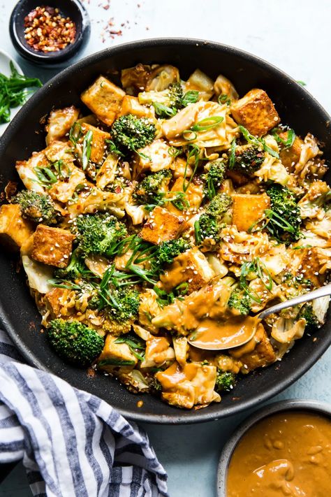 Creamy, garlicky, gingery homemade peanut sauce makes this super healthy tofu and vegetable stir-fry into a hearty, satisfying vegan dinner even omnivores will love. Sauce For Tofu, Homemade Peanut Sauce, Tofu Stir Fry, Vegan Mushroom, Mushroom Pasta, Giada De Laurentiis, Vegan Comfort Food, Pita Chips, Fried Vegetables