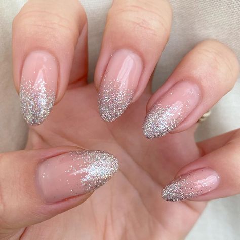 Silver Glitter Gradient Nails, Oval Glitter Ombre Nails, Natural French Tip Nails With Glitter, Silver Acrylic Nails Almond Shape, Silver Fade Nails, Silver Glitter Fade Nails, Clear Nails With Silver Glitter, Silver Sparkle Ombre Nails, Glitter Nails Ombre Sparkle