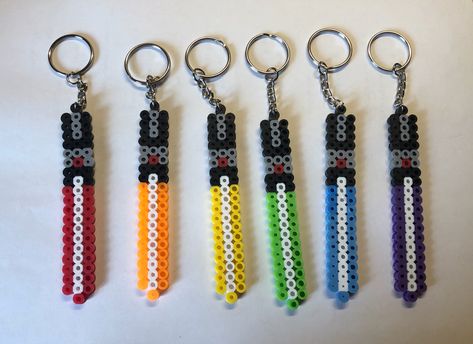 Lightsaber Perler Beads, Perler Keychain Pattern, Perler Bead Crafts To Sell, Perler Keychain Ideas, Mini Perler Bead Patterns, Perler Beads Keychain, Perler Keychain, Perler Bead Keychain, Melty Bead Designs